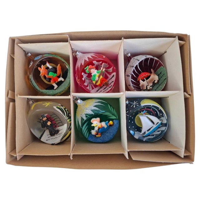 Exceptional set of six vintage Czechoslovakian glass Christmas ornaments dating to circa 1960. Each ornament is...