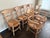 A charming set of six French Country style dining chairs with rustic appeal. The set includes four side chairs and two...