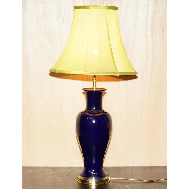 Cobalt Blue with solid brass base Urn shaped Porcelain table lamp signed by the artist and made by Ugo Zaccagnini. A good...