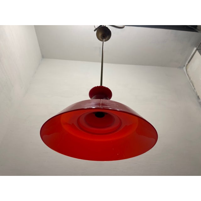 Red murano glass light pendant 1950’s bronze fittings red glass shade in excellent conditions height including rod 79 cm...