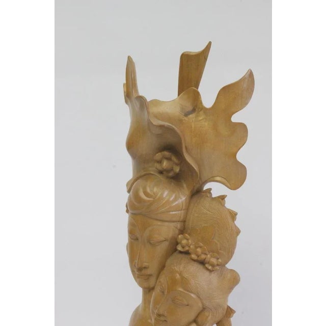 Art Deco Balinese Woodcarving Of A Couple, 1930s. Good vintage condition, 2 chips on the edge. Shown in the pictures.