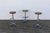 Striking set of three Mid-Century Modern swivel bar stools, crafted in the United States circa the 1970s. Combining warm...