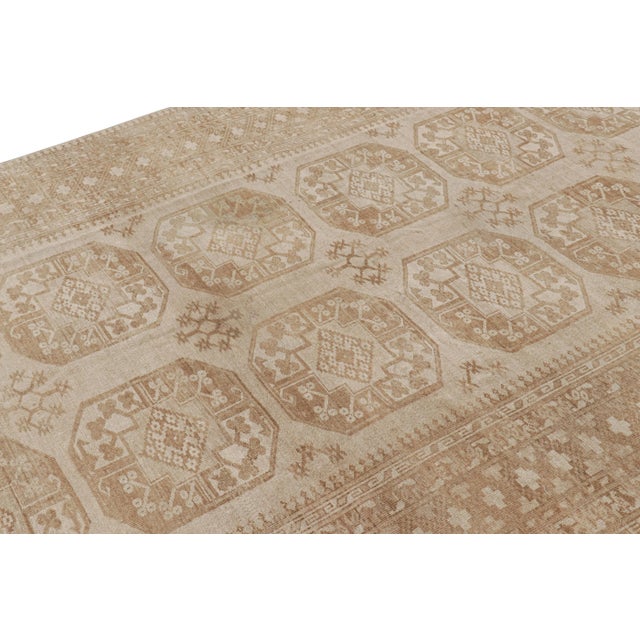 Hand-knotted wool and originating from Turkey circa 1950-1960, this 7x11 vintage Ersari rug is from the same provenance, a...