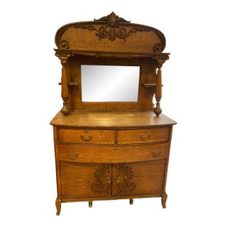 Early 20th Century Quarter-Sawn Tiger Oak Sideboard With Carved Crest, Beveled Mirror and Turned Columns For Sale