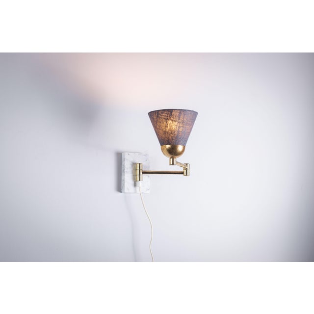 This vintage folding arm wall lamp with a marble base is a stunning piece that blends classic elegance with functional...