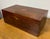 An elegant antique English table box from the Edwardian era, crafted from mahogany with fruitwood inlay and enriched by a...