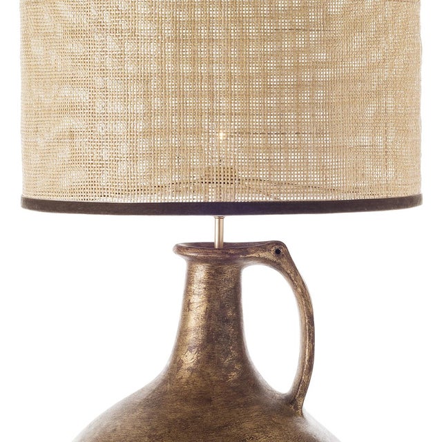 Mmasterfully handmade jug ceramic table lamp matched with cylindrical shade. The simple artisan jug shape is emphasized by...
