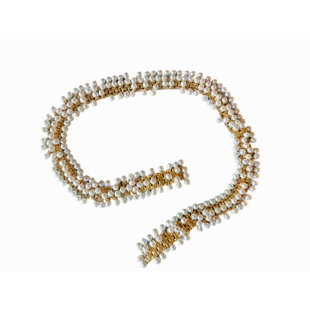Rare 1980s Christian Dior belt composed of faux ivory toned pearls attached to a gold plate link belt. Pearls move and...