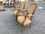 Chic and elegant best describe this pair of Louis XVI fauteuils. Made of fruitwood, these chairs feature solid carved...