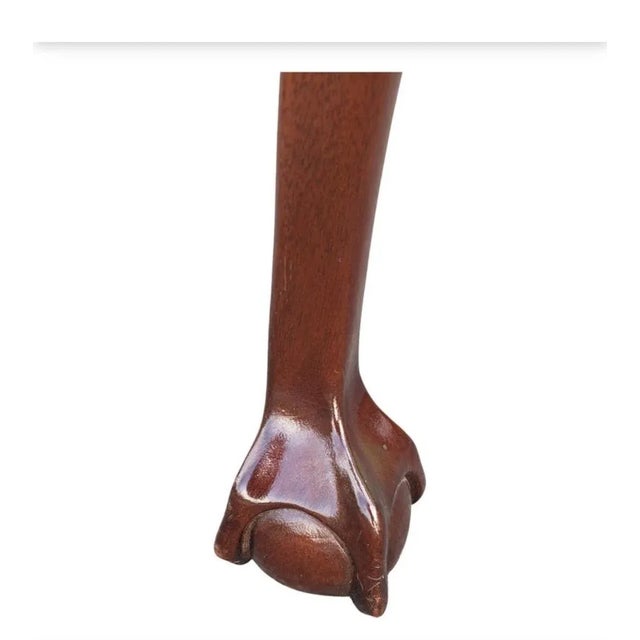 Chippendale Flame Mahogany Tea Table with Pierced Gallery, carved cabriole legs terminating with ball and claw feet....