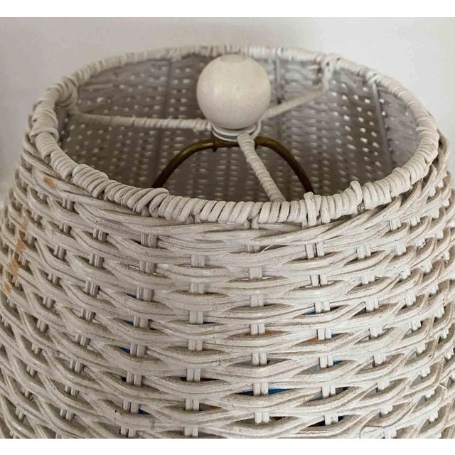 Vintage 1980's wicker lamp with shade. White paint with intricate design.