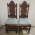 A pair of heavily carved English Jacobean style oak hall chairs. They high backs measuring almost 51" high and hand carved...