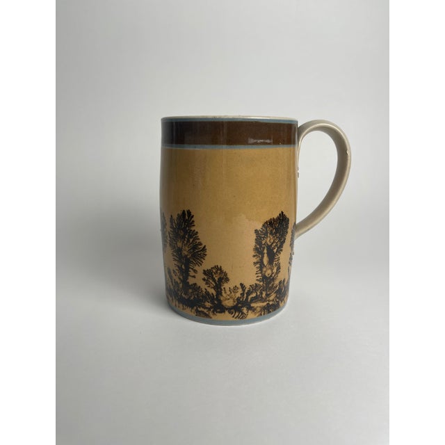 This Mocha ware "Seaweed" mug is a vibrant example of the playful and organic decoration that made this style so beloved....
