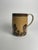 This Mocha ware "Seaweed" mug is a vibrant example of the playful and organic decoration that made this style so beloved....