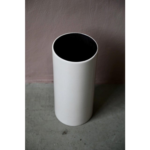 with its understated elegance, this large cylindrical vase reflects the modernist aesthetic of West German ceramics from...