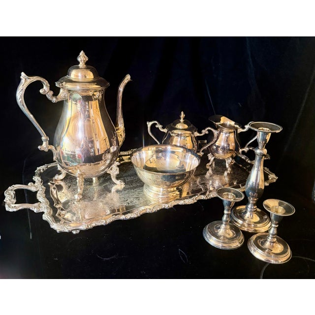 This elegant vintage service set features classic silver-plated construction over copper with intricate, ornate detailing...