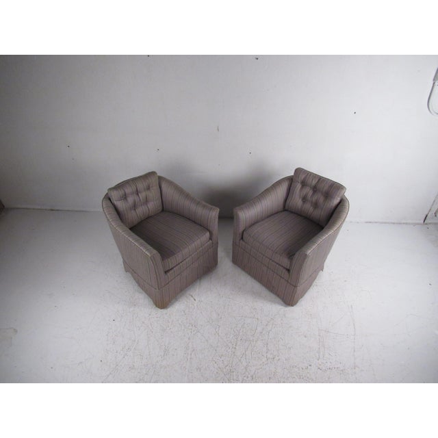 This gorgeous pair of vintage modern lounge chairs feature two overstuffed removable cushions and plush upholstery. A...