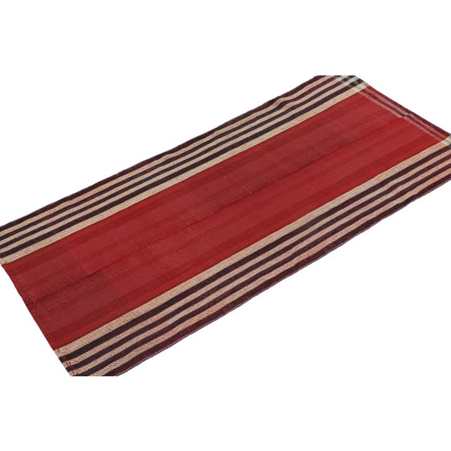 This vintage 3x7 Persian Kilim is a mid-century tribal runner, handwoven in wool circa 1950-1960. Its design most likely...