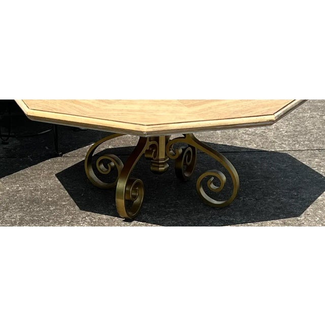 Octagon Coffee Table in a Natural Wood Grain Tone with a Golden Base . Constructed of a Solid Wood Top.