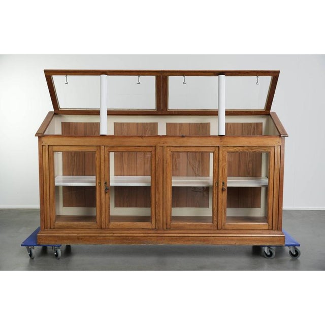 This counter/museum cabinet has 4 doors and removable shelves; the top of the cabinet opens. Through years of proper use,...