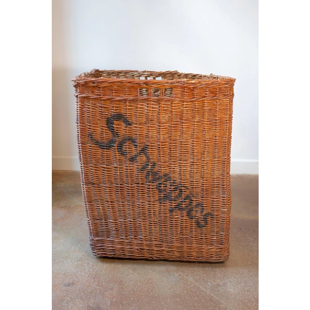A rare and sculptural early 20th-century English wicker advertising basket, originally used for transporting or displaying...