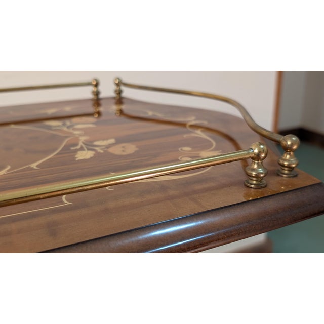 Beautiful inlaid cart made in Sorrento, Italy. The variety of light woods of the delicate, floral inlay are a lovely...