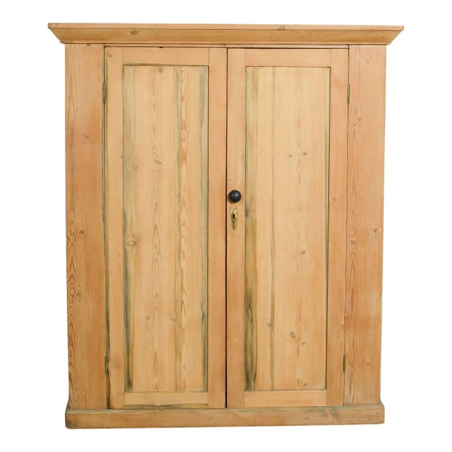 Sturdy Pine wardrobe with beautiful molding details from Europe. Perfect for functional and attractive storage in any room.