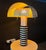 Shogun table lamp by mario botta for artemide, 1986 ca. Embossed cast iron, enamelled metal, enamelled metal grid....