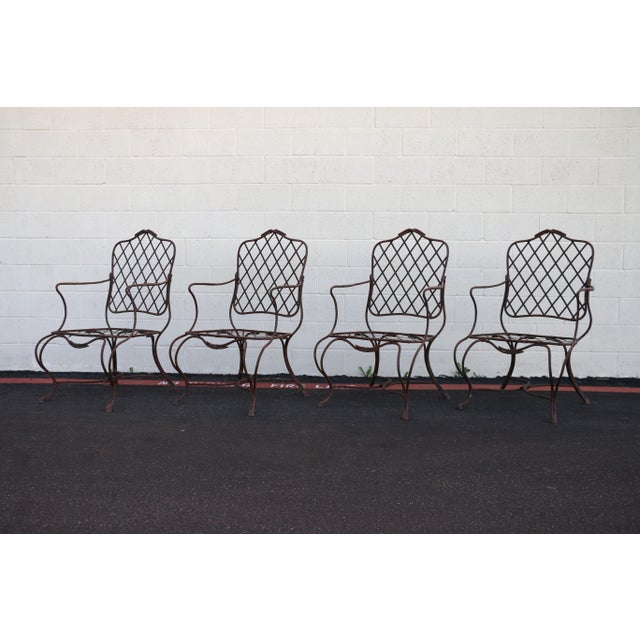 Iconic vintage set of four outdoor armchairs attributed to Gregorius Pineo, Los Angeles. These sculptural patio chairs...