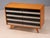 A classic mid-century model u453 sideboard designed by jiří jiroutek for interier praha, featuring a compact rectangular...