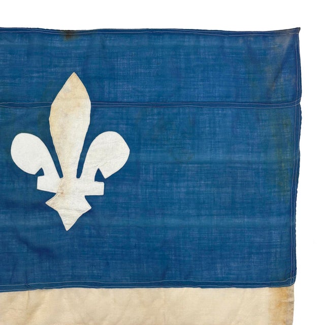 This large vintage Quebec Flag is made from a sheer woolen cloth, with fully sewn design visible on both sides. Please...
