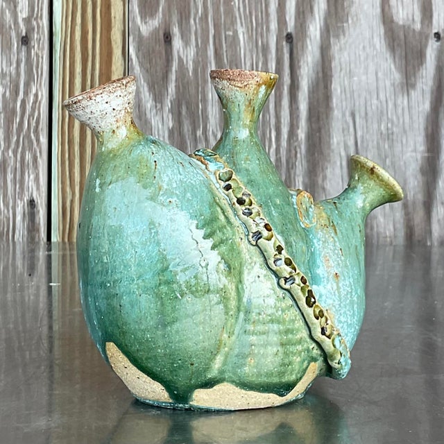 This vintage Boho studio pottery vase features a handcrafted design with earthy tones, perfect for adding a touch of...