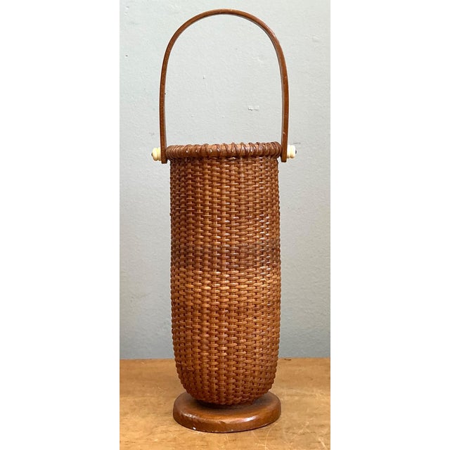 This vintage Shaker tall woven rattan basket exemplifies the timeless simplicity and purposeful beauty associated with...