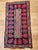 This vibrant vintage American hand-hooked rug, created in the early 1900s in the New England region, is a striking example...