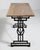 A French 20th century bistro table pairing a sturdy cast iron base with an oak top, combining industrial durability with...