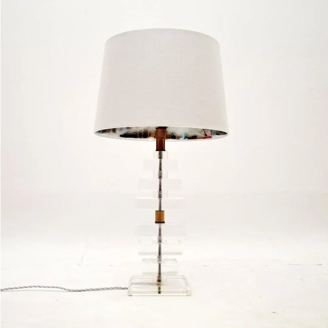 A very stylish and extremely well made vintage acrylic and brass table lamp. This was likely made in France, it dates from...