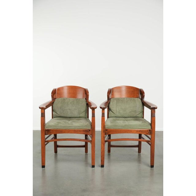 This unique set of 8 dining chairs from the Art Nouveau/Jugendstil series by Schuitema with suede upholstery. : This...