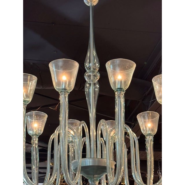 The Large Scale Murano 10-Arm Fontana Green Chandelier is a stunning and elegant lighting fixture designed to make a...