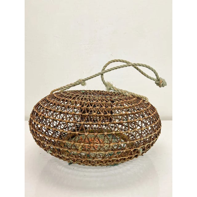 An old Wire cage used for transporting shell fish. Fun and rare. Dimensions: Height: 22.5 cm Diameter:39 cm Style: Mid-...