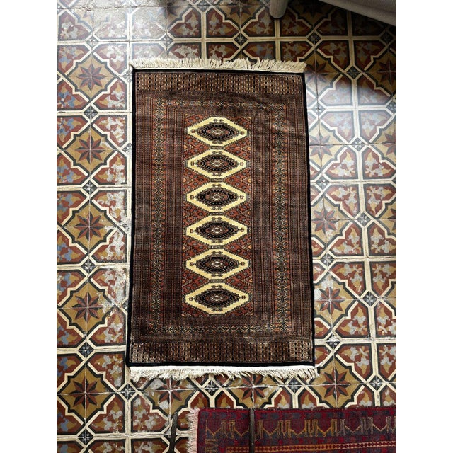 This hand-knotted Oriental rug is a beautiful piece of craftsmanship, featuring a rich pattern and deep, warm colors....