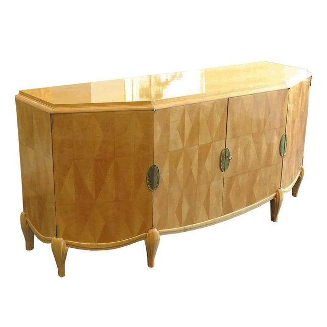 This French Art Deco angled sycamore frame sideboard by Pierre Lucas features citron wood diamond parquetry on four doors....