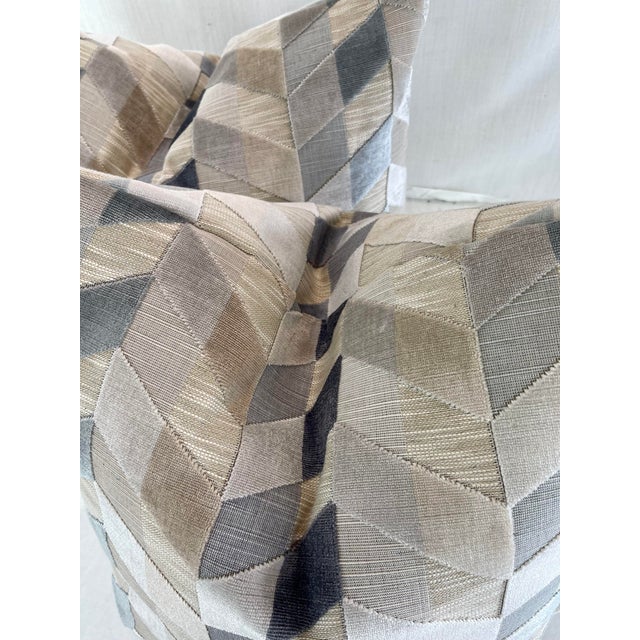 Custom pair of 22" pillows covered in a cut velvet fabric in a chevron pattern of neutrals and grays. These pillows have...