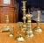 This is a mixed lot of antique and vintage English style brass candlesticks that range from 3.75”H to 12.5”. There is one...