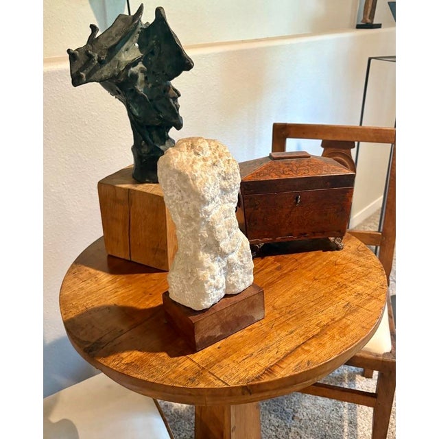 Handsome hand carved white marble torso with a chiseled texture on a wood base by listed and well known artist ‘Si’ Gordon...