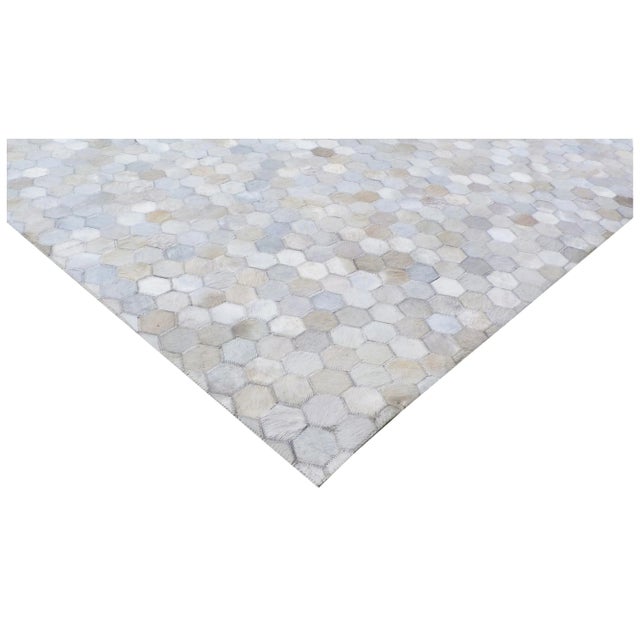 Carefully selected hair-on hide sections in various shades and colors are hand-stitched together to create a stunning and...