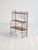 Freestanding bookcase with black-painted iron frame and adjustable teak shelves. Scandinavia, 1960s. A modular shelving...
