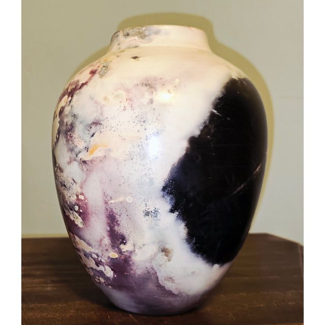 A striking studio pottery vase by California ceramic artist Joel Magen, showcasing his signature marbled, mineral‑strata...