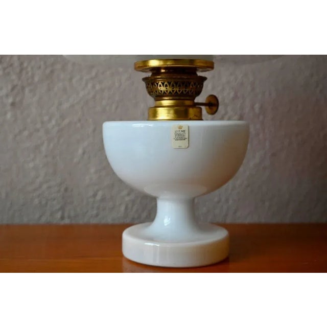 A playful nod to the traditional, everyday products of Danish glassworks Holmegaard, the "Victoria" series of oil lamps...