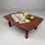 This small Japanese table from the 1950s has a restrained and refined appearance. Dimensions: height 21 cm, width 59 cm,...