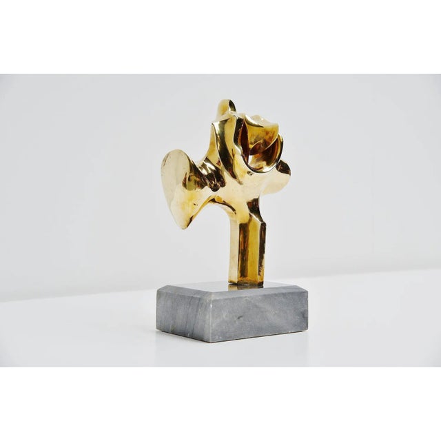 Abstract modern sculpture in bronze by Hattakitkosol Somchai (Bangkok, 1934-2000). This fantastic shaped sculpture has the...